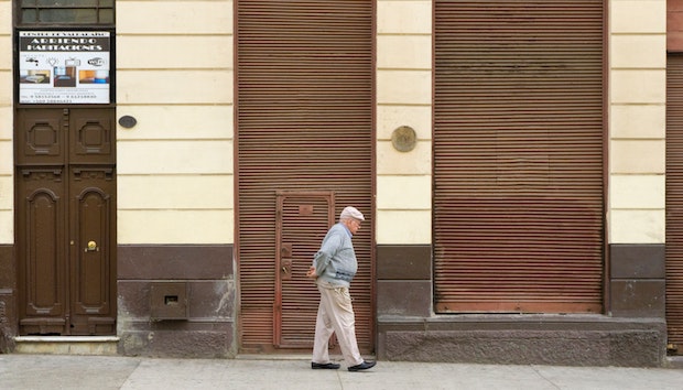 an old man walking down the street