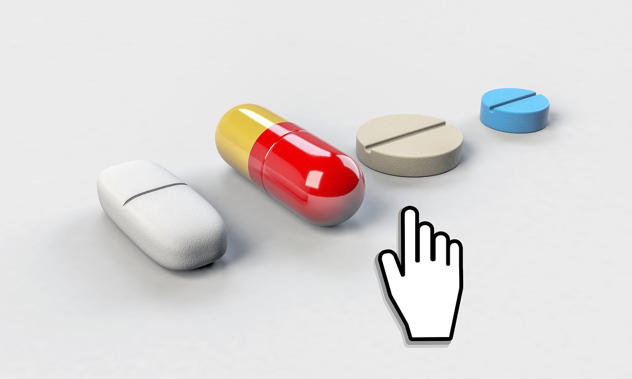 Graphic showing four different pills on a white surface, with a cursor hovering over them.